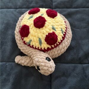 Crocheted Turtle Plush with pizza dinner